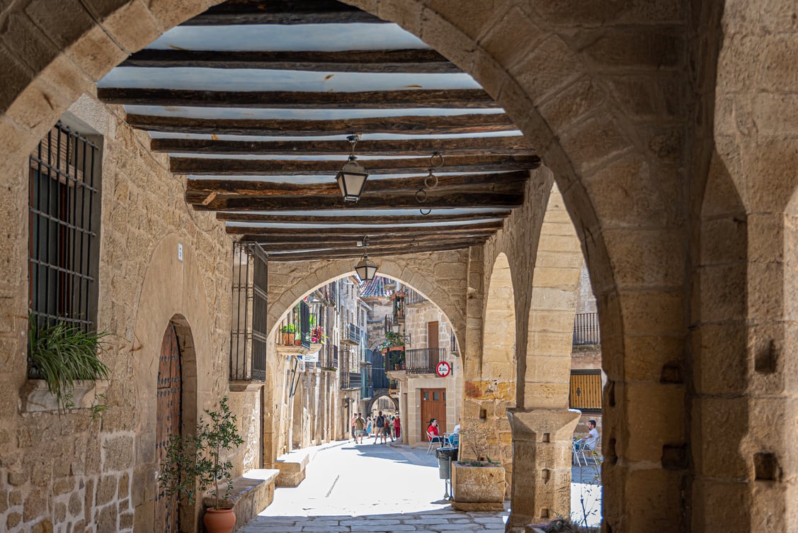 View of an old historical stone village street in Calaceite, Teruel, Aragon, Spain